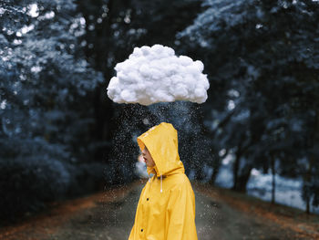 Rear view of woman standing on snow