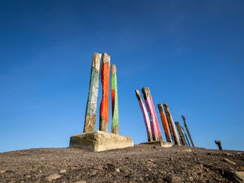Low angle view of man standing on rock