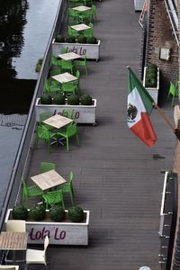 High angle view of flag sign on railing