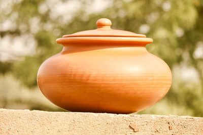 Close-up of pot against blurred background