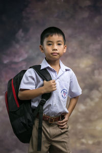 Portrait of young man standing outdoors