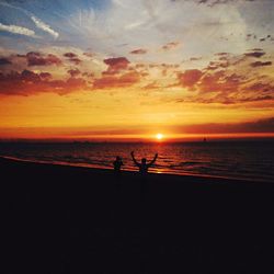 Scenic view of sea at sunset