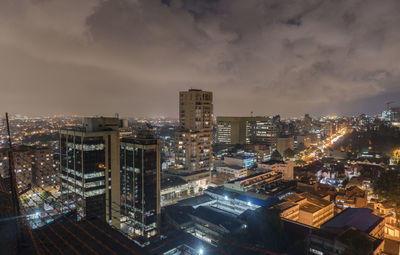 High angle view of illuminated buildings in city at night