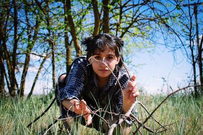 Woman on field crouching
