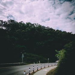 View of bridge against cloudy sky