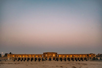 View of historic building against sky during sunset