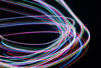 Close-up of light painting against black background