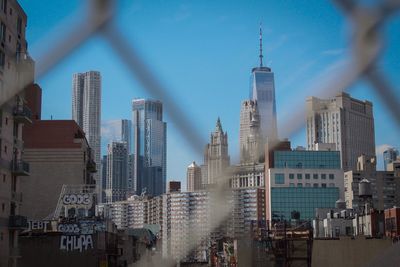 Skyscrapers in city against sky