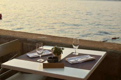 Set table of a restaurant with a sea view