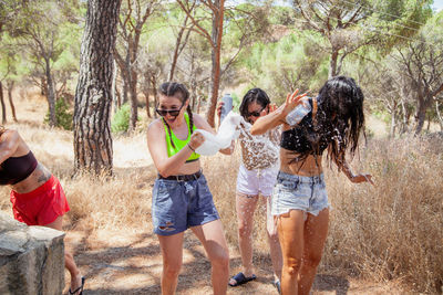 Cheerful women enjoying in forest