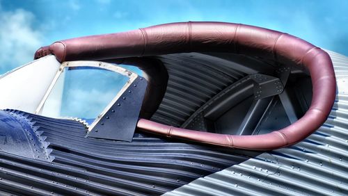 Close-up of airplane against sky