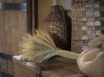 Wheat and sack on wooden table