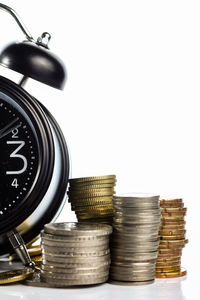 Stack of coin against white background