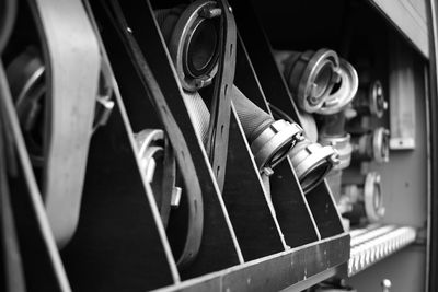 Close-up of hoses in shelf