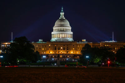 Illuminated buildings in city at night