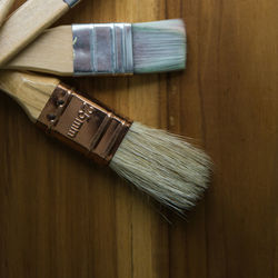 Directly above view of paintbrushes on table