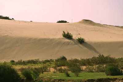 Scenic view of desert against clear sky