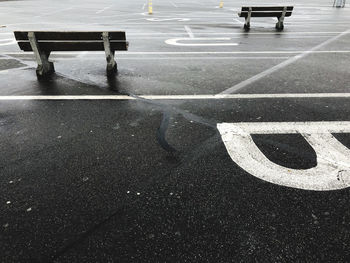 High angle view of arrow symbol on road in city