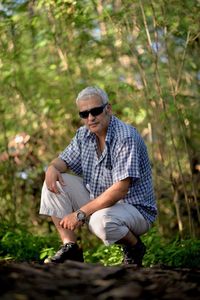 Full length of man climbing on tree