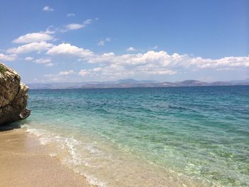 Scenic view of sea against cloudy sky