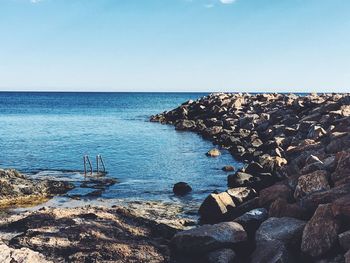 Scenic view of sea against blue sky