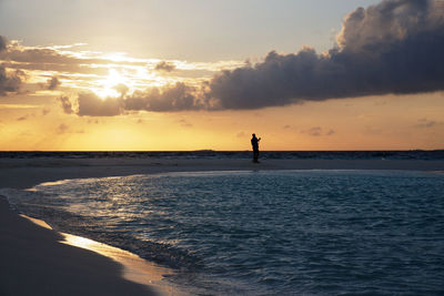 Scenic view of sea at sunset