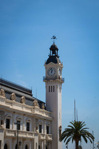 Low angle view of clock tower against sky