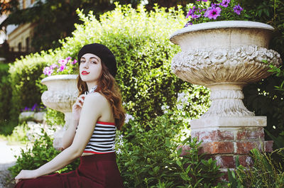 Portrait of young, happy, elegant redhead curly woman, girl in hat, casual clothes. french style. 