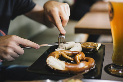 Close-up of person preparing food on table