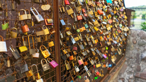 Padlocks hanging on railing