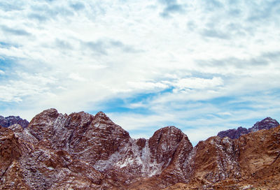 Low angle view of rocks against sky