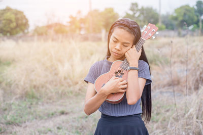 Full length of girl playing on field