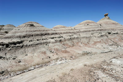 Scenic view of desert against clear sky