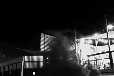 Low angle view of illuminated building at night