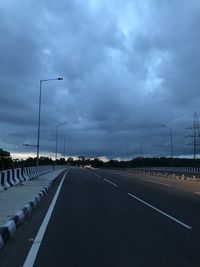 Highway by street against sky