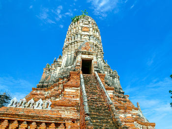 Low angle view of historical building against blue sky