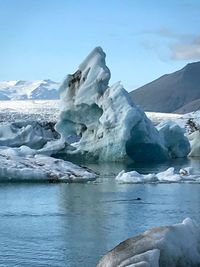 Scenic view of frozen lake against sky