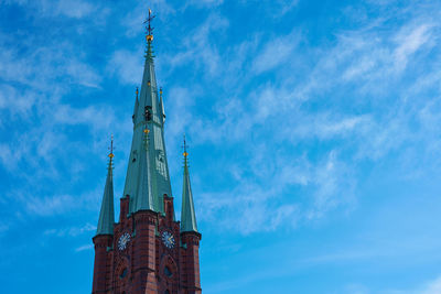 Low angle view of building against blue sky