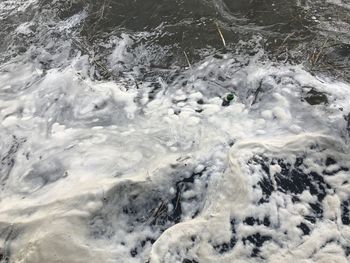 High angle view of water flowing in sea