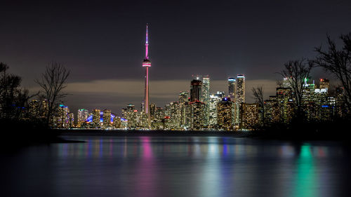 Illuminated cn tower in city at night