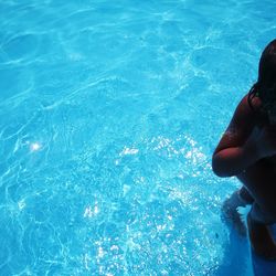 Low section of woman in swimming pool