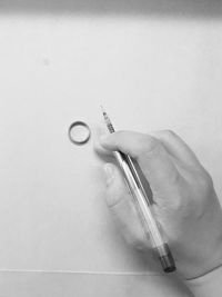 Close-up of hand holding ring