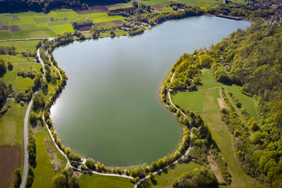 High angle view of river amidst green landscape