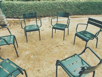 Empty chairs and tables in park