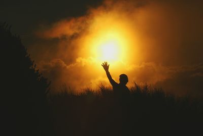 Silhouette person at mount pulag during sunset