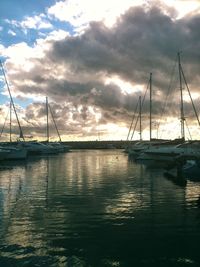 Sailboats sailing in sea against sky