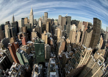 High angle view of city buildings against sky