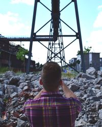 Man standing on railing