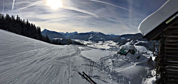 Scenic view of snow covered mountains against sky