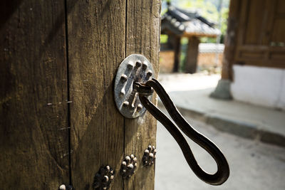 Close-up of metal door of building